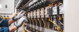 electricity and electrical maintenance service engineer hand holding ac voltmeter